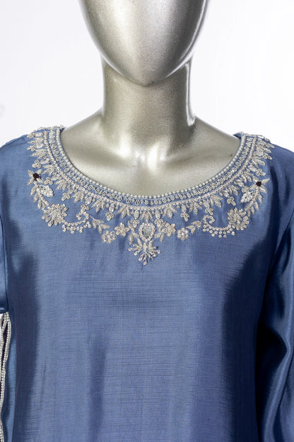 Abeera – Steel Blue Sheesha Silk embroidered suit with medium silk dupatta & straight trousers by MariamRaj. Perfect festive wear.