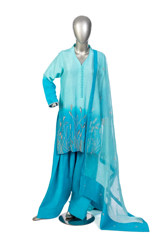 Aira – Festive Blue Korean Silk suit with hand embroidery, farshi shalwar & organza dupatta by MariamRaj. Perfect festive & wedding wear.