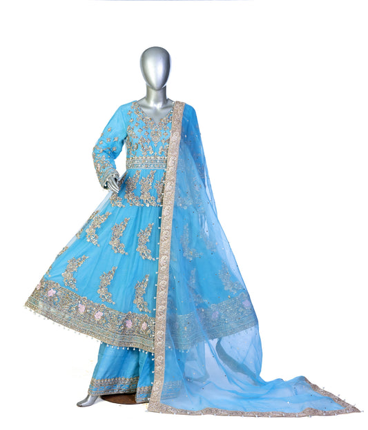 Sky-blue Pakistani Anarkali dress by MariamRaj with floral embroidery, sharara pants, and net dupatta – perfect for weddings and occasions in the USA.