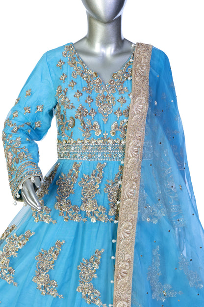 Sky-blue Pakistani Anarkali dress by MariamRaj with floral embroidery, sharara pants, and net dupatta – perfect for weddings and occasions in the USA.