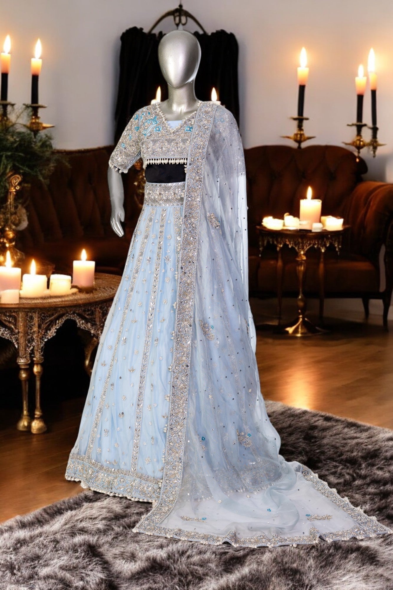 Elsa – Ice blue Pakistani bridal lehenga by MariamRaj featuring a hand-embroidered raw silk blouse with tassels, net lehenga with intricate motifs, and a fully embellished net organza dupatta. Custom stitched for Pakistani brides in USA and UK.