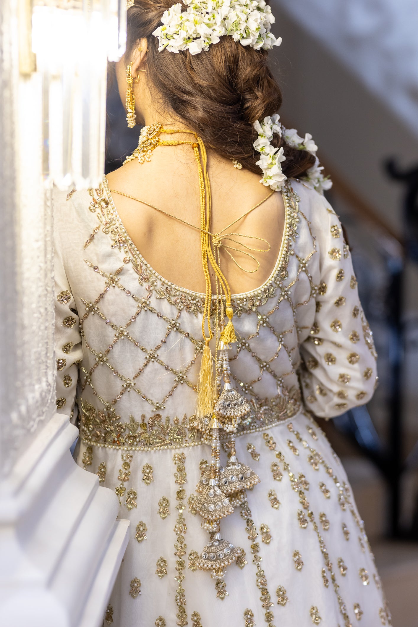 White Pakistani bridal outfit with pure organza shirt and dupatta, paired with silk lehenga – elegant nikkah dress for brides in USA, UK, and Canada.