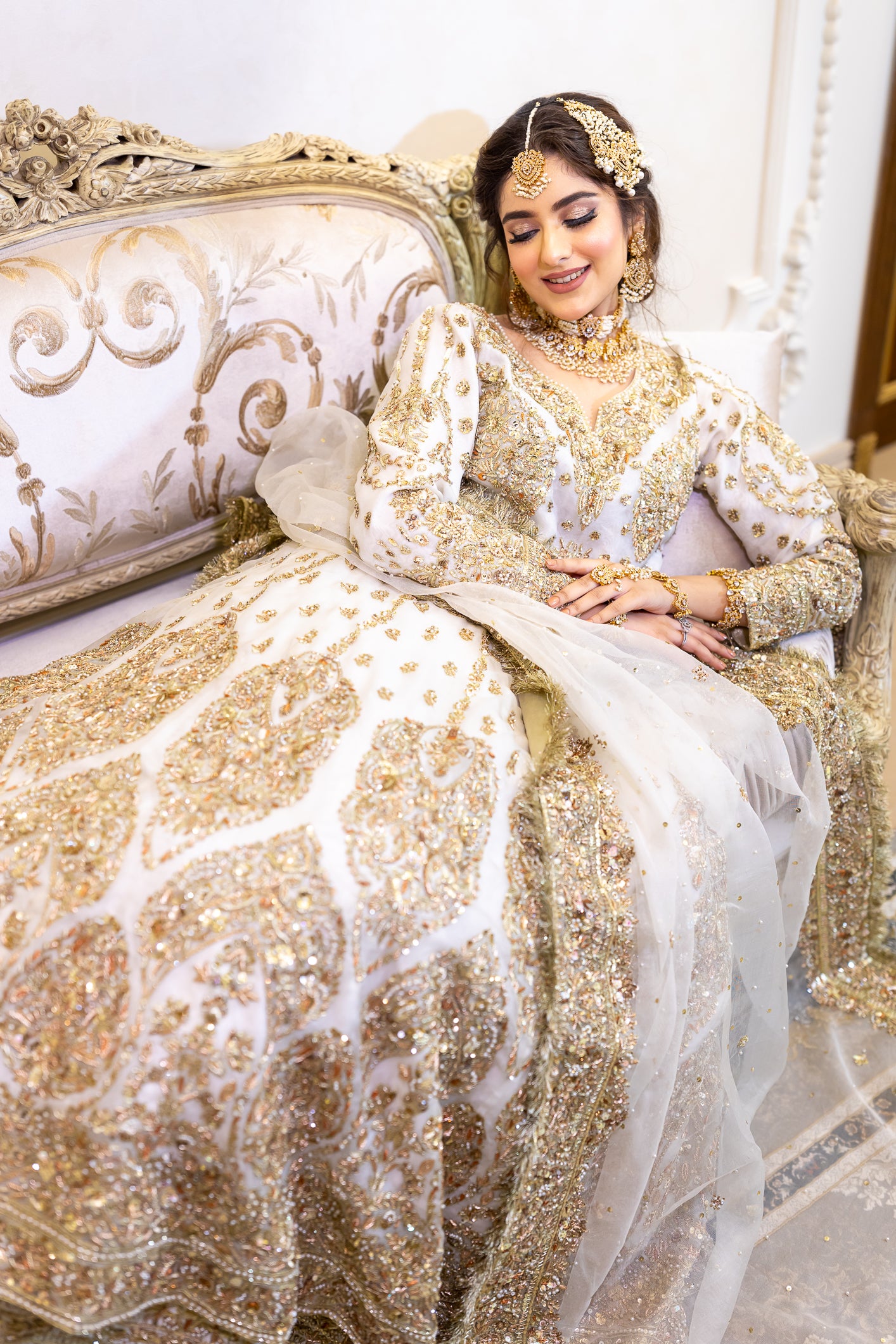 White Pakistani bridal outfit with pure organza shirt and dupatta, paired with silk lehenga – elegant nikkah dress for brides in USA, UK, and Canada.