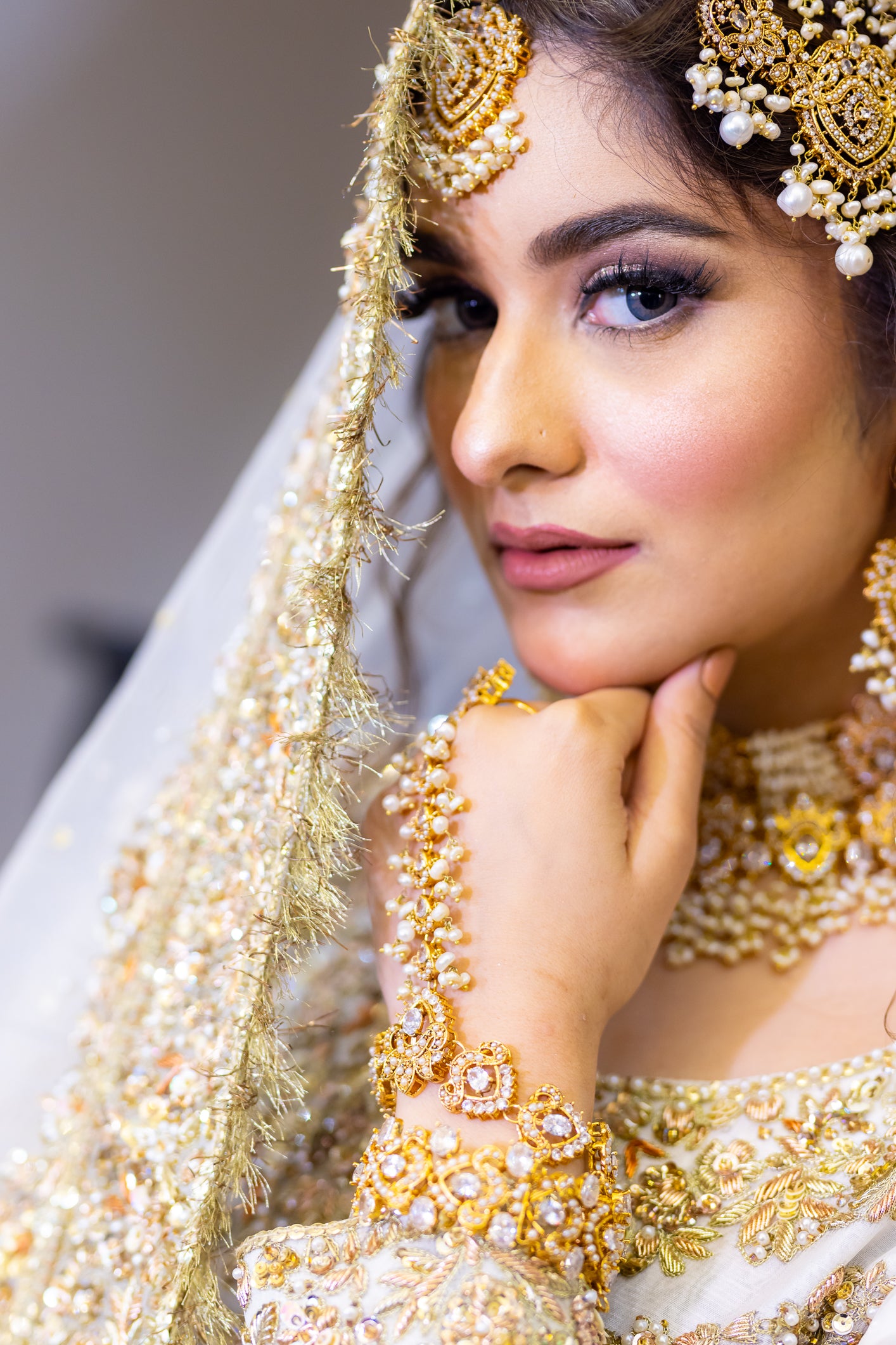 White Pakistani bridal outfit with pure organza shirt and dupatta, paired with silk lehenga – elegant nikkah dress for brides in USA, UK, and Canada.