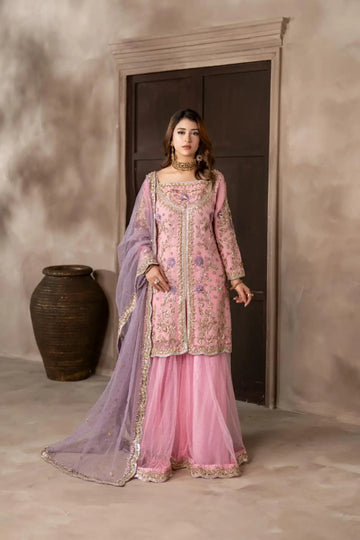 Mahgul powder pink hand embellished organza wedding suit with Kamdani net sharara and lavender net dupatta by MariamRaj