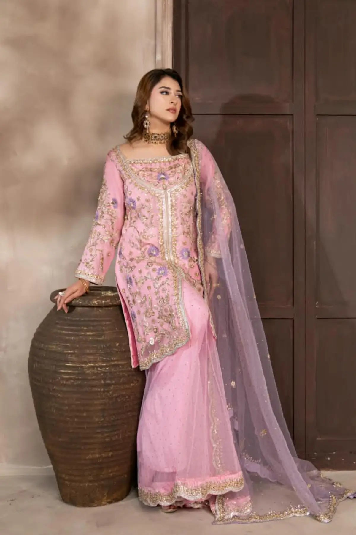 Mahgul powder pink hand embellished organza wedding suit with Kamdani net sharara and lavender net dupatta by MariamRaj
