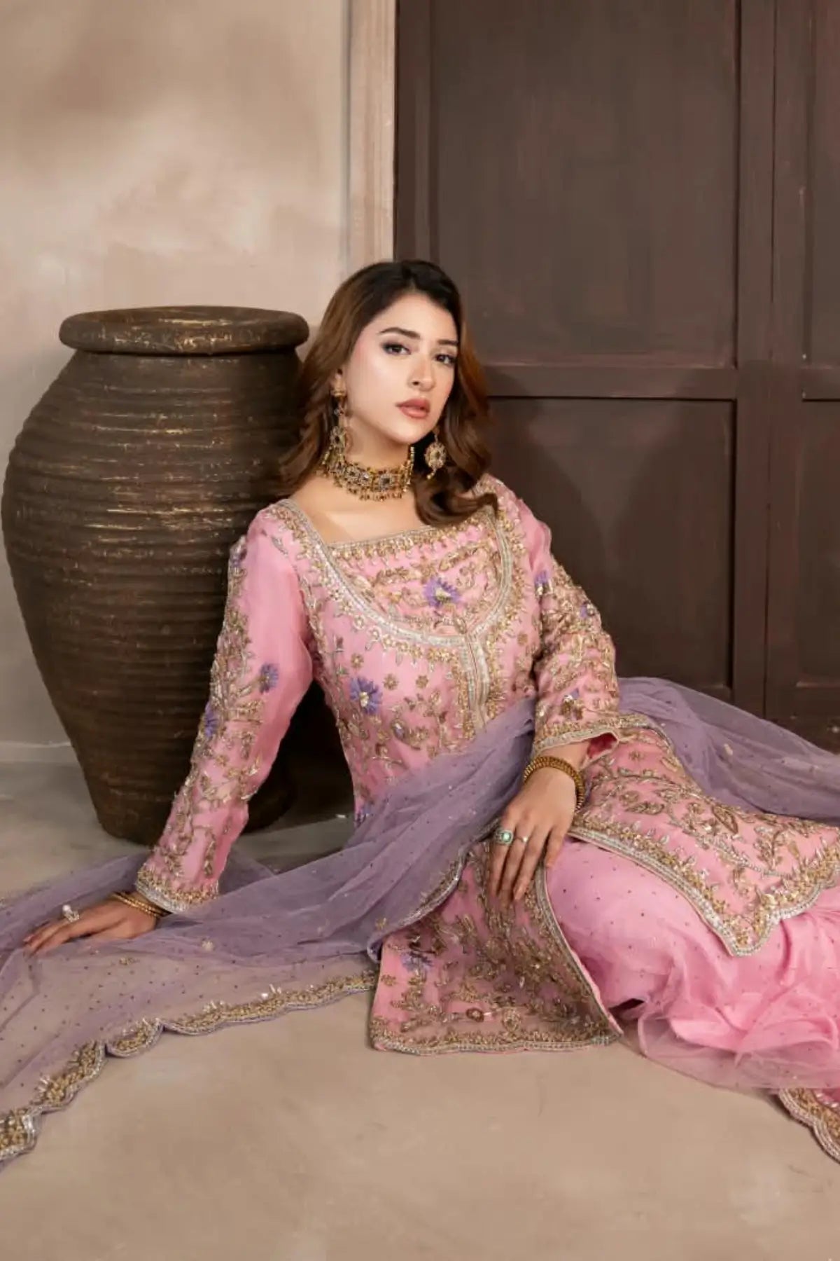 Mahgul powder pink hand embellished organza wedding suit with Kamdani net sharara and lavender net dupatta by MariamRaj