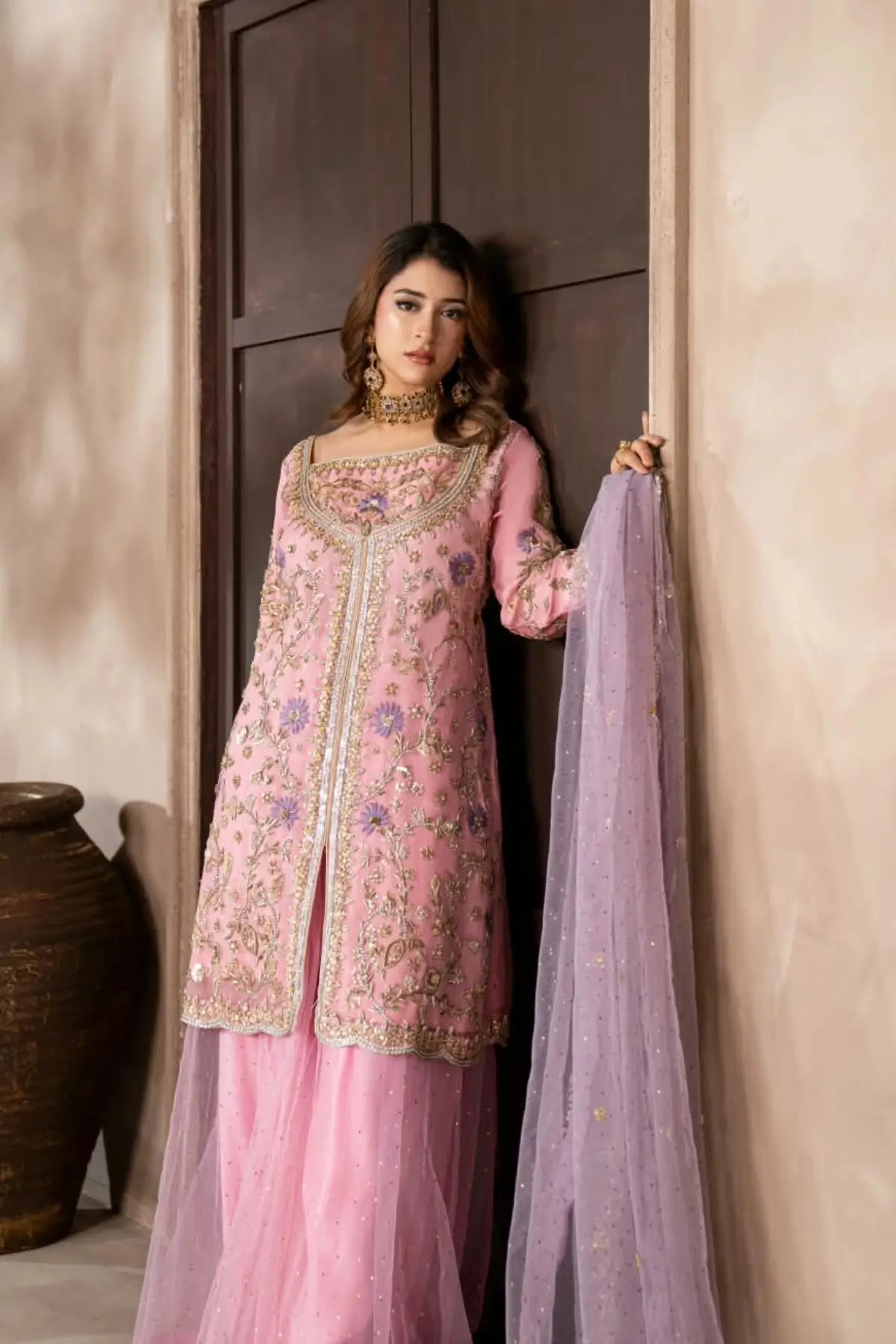 Mahgul powder pink hand embellished organza wedding suit with Kamdani net sharara and lavender net dupatta by MariamRaj