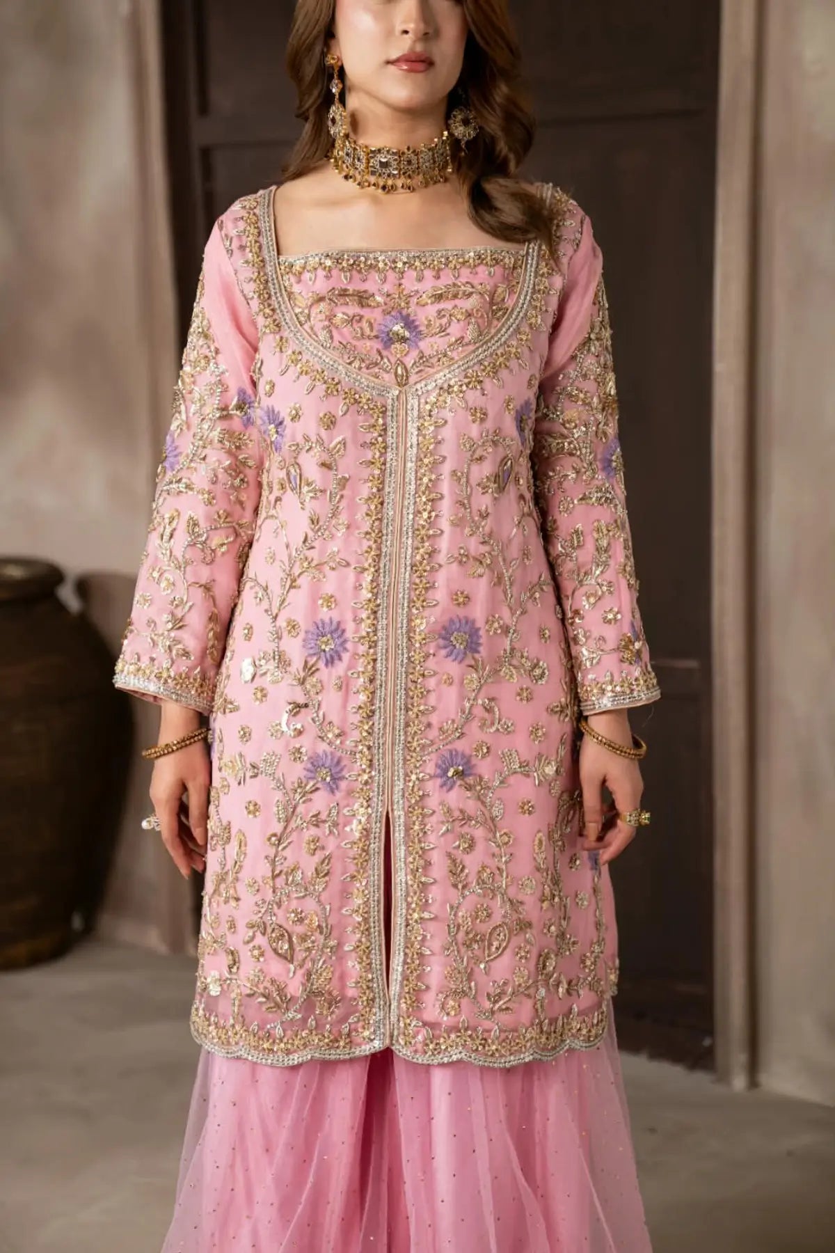 Mahgul powder pink hand embellished organza wedding suit with Kamdani net sharara and lavender net dupatta by MariamRaj