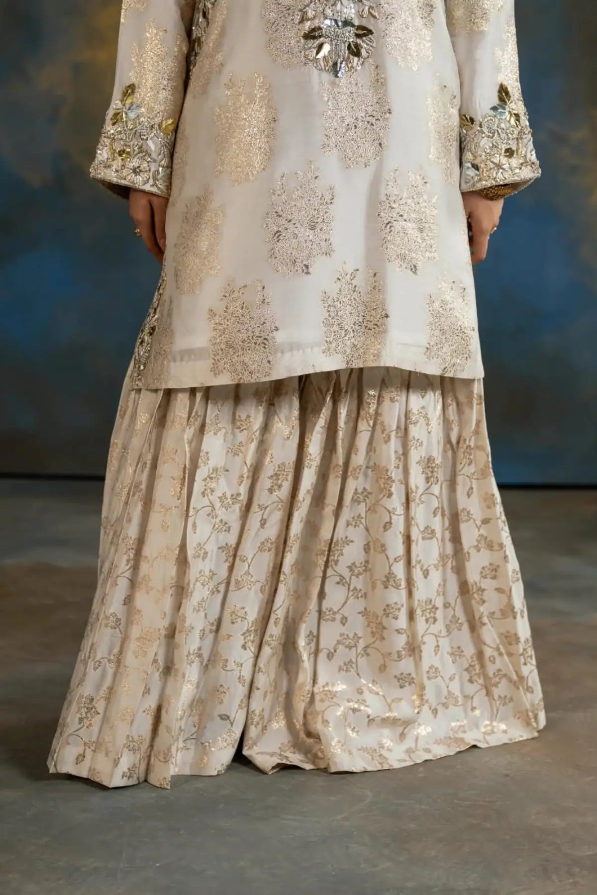 Mahpara ivory printed Sheesha Mukesh gharara suit with organza dupatta from Afsanah Collection by MariamRaj