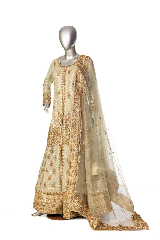 Olive green and gold Pakistani bridal Anarkali dress by MariamRaj, featuring gold and copper handwork, gold lehenga, and net dupatta – custom stitched for UK weddings.