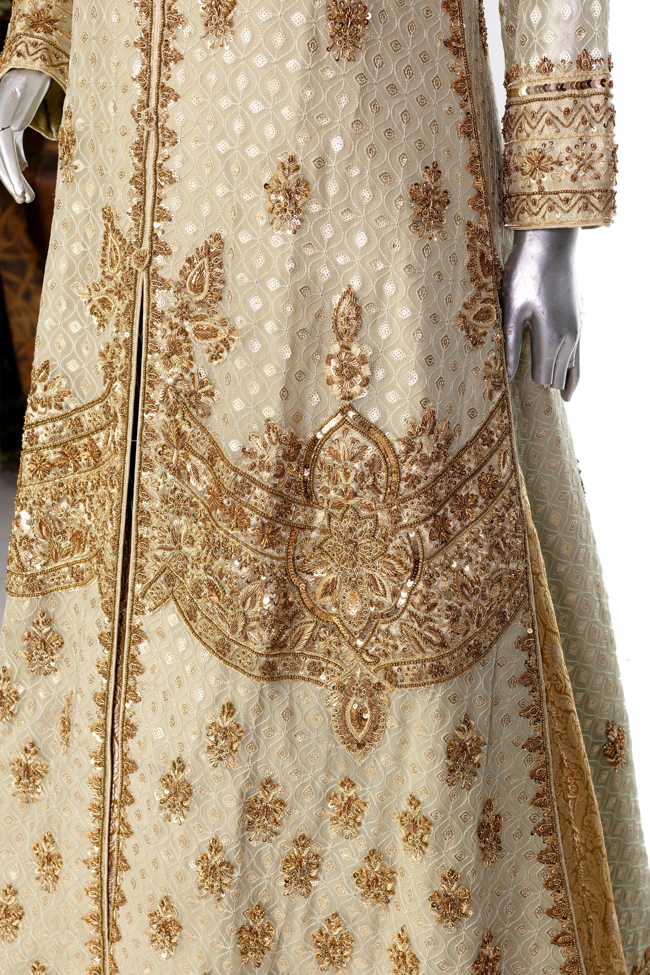 Olive green and gold Pakistani bridal Anarkali dress by MariamRaj, featuring gold and copper handwork, gold lehenga, and net dupatta – custom stitched for UK weddings.