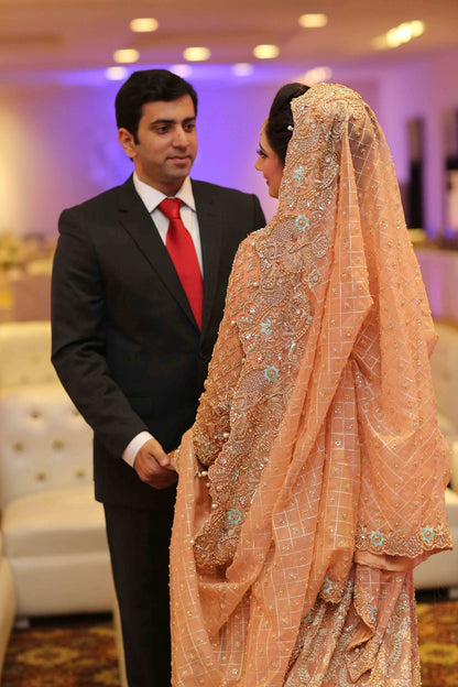 Peach pink organza kurti and farshi lehenga with embroidered dupatta – Pakistani bridal outfit for USA, Canada, and Europe.