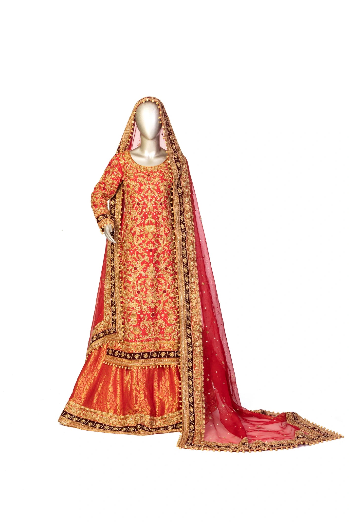 Red bridal lehenga outfit by MariamRaj featuring embroidered kameez, gold-detailed lehenga, and net dupatta with golden ball edging – ideal for Pakistani barat weddings.