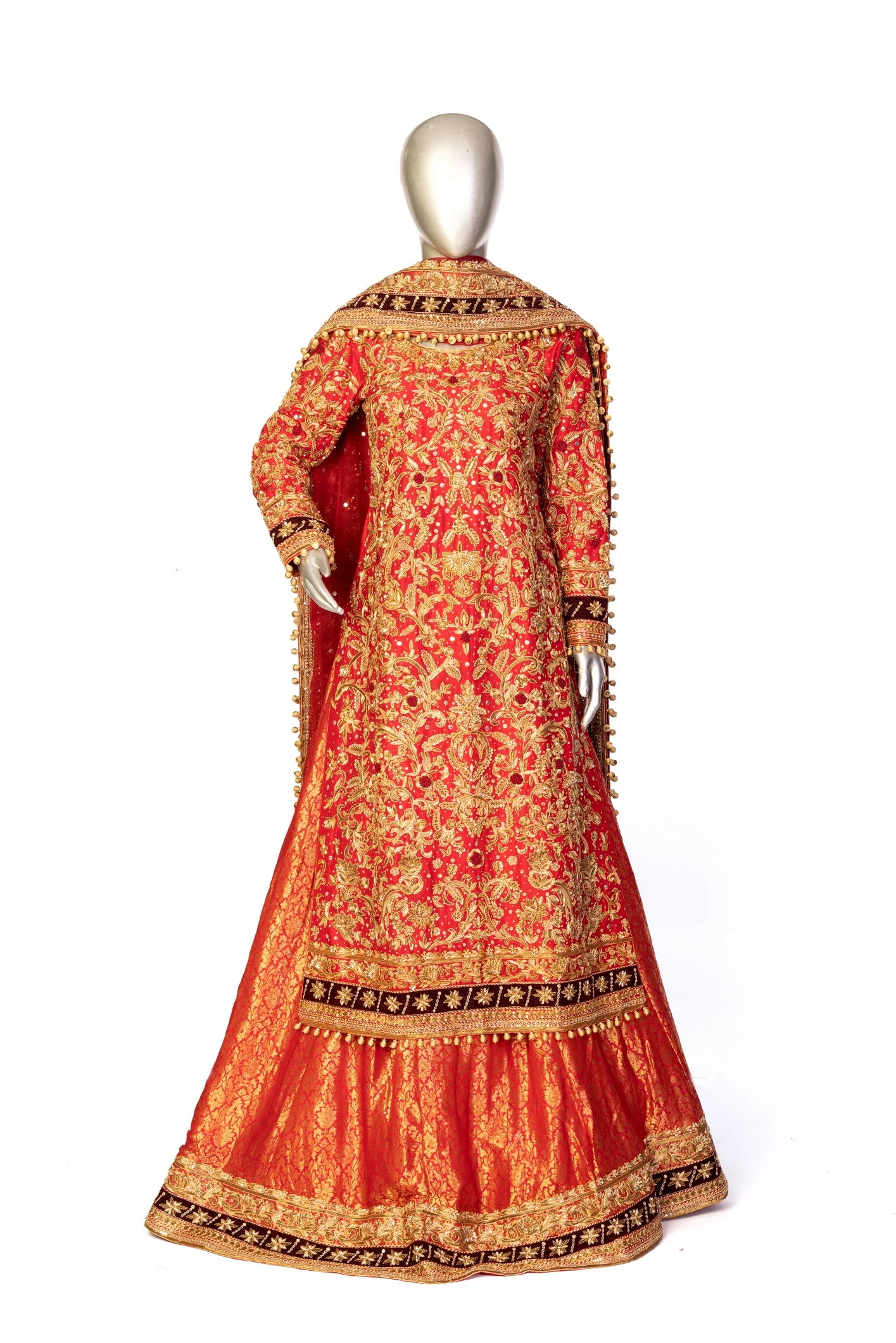 Red bridal lehenga outfit by MariamRaj featuring embroidered kameez, gold-detailed lehenga, and net dupatta with golden ball edging – ideal for Pakistani barat weddings.