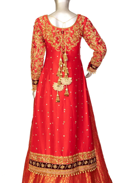 Red bridal lehenga outfit by MariamRaj featuring embroidered kameez, gold-detailed lehenga, and net dupatta with golden ball edging – ideal for Pakistani barat weddings.