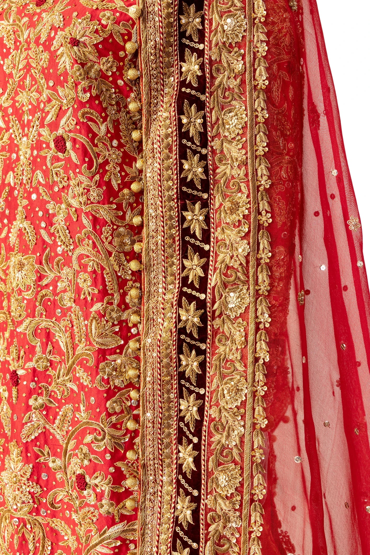 Red bridal lehenga outfit by MariamRaj featuring embroidered kameez, gold-detailed lehenga, and net dupatta with golden ball edging – ideal for Pakistani barat weddings.