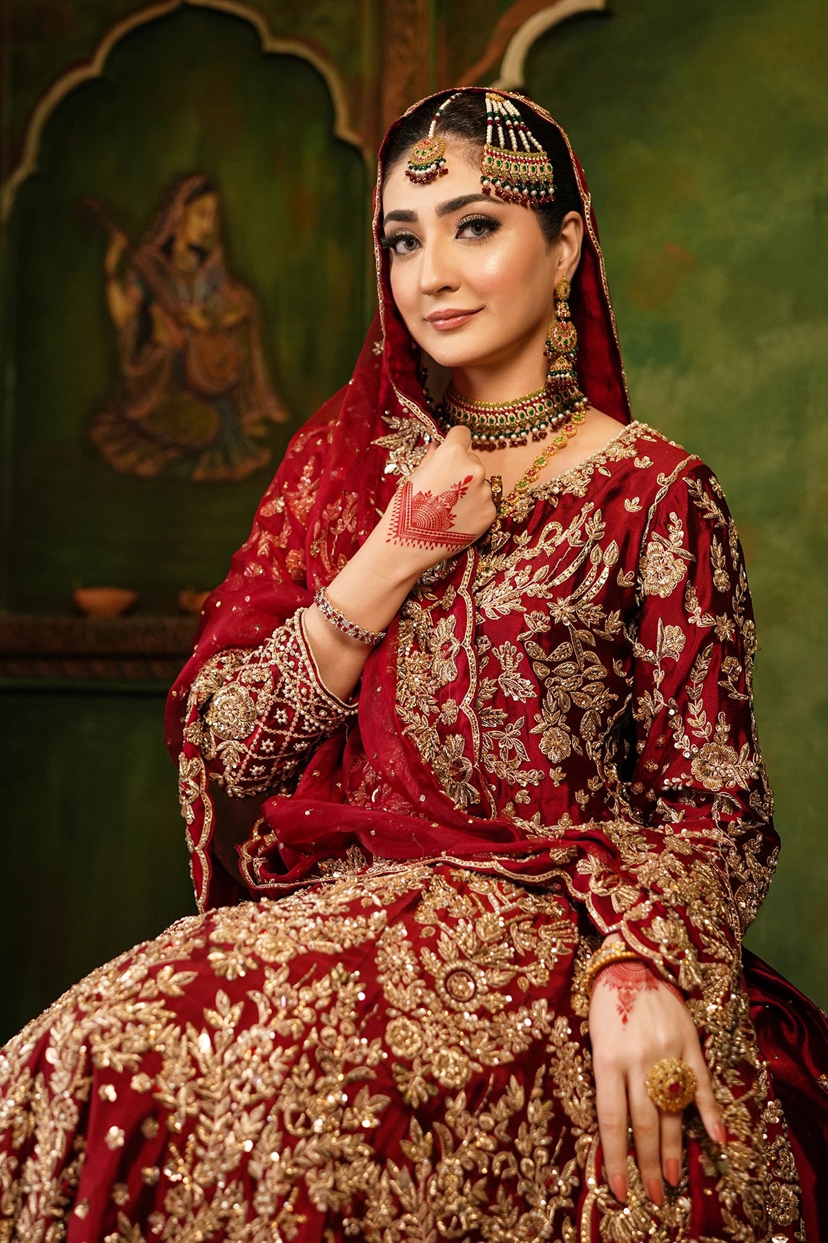 Shehrbano deep red Tassel Silk Pakistani bridal lehenga choli with gold handwork and organza dupatta by MariamRaj