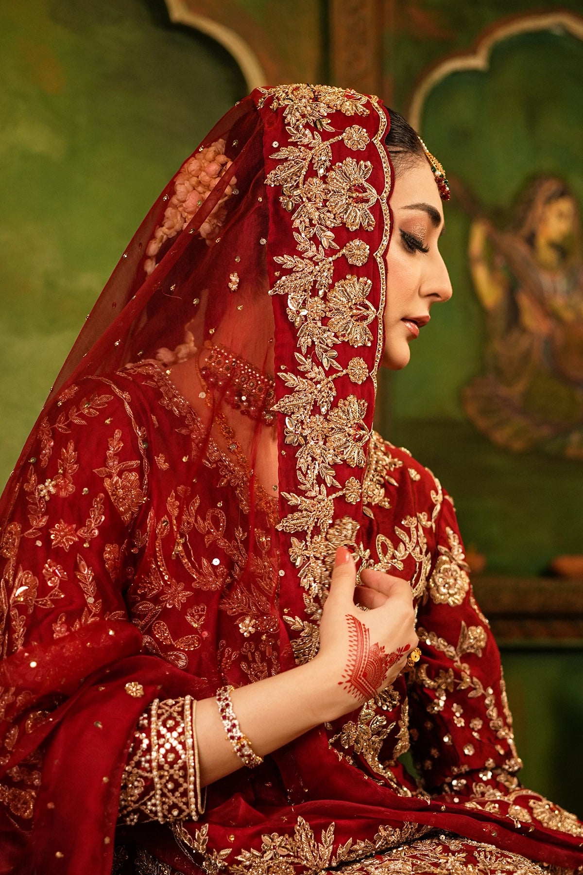 Shehrbano deep red Tassel Silk Pakistani bridal lehenga choli with gold handwork and organza dupatta by MariamRaj