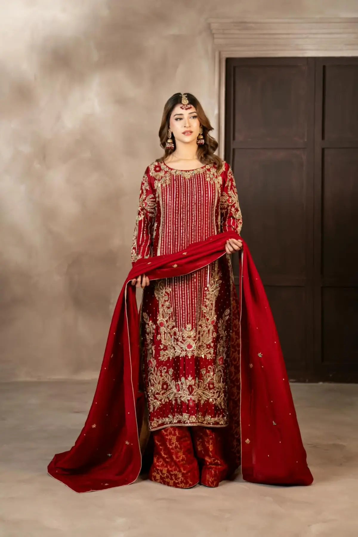 Surkhroo deep red hand embellished Sheesha silk formal suit with Jamawar palazzo and organza dupatta by MariamRaj