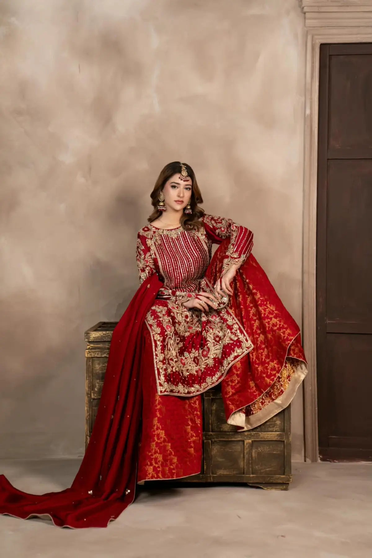 Surkhroo deep red hand embellished Sheesha silk formal suit with Jamawar palazzo and organza dupatta by MariamRaj