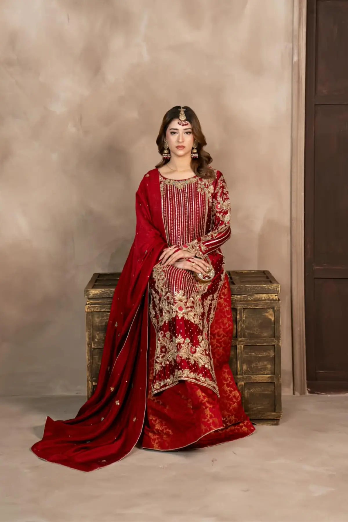 Surkhroo deep red hand embellished Sheesha silk formal suit with Jamawar palazzo and organza dupatta by MariamRaj
