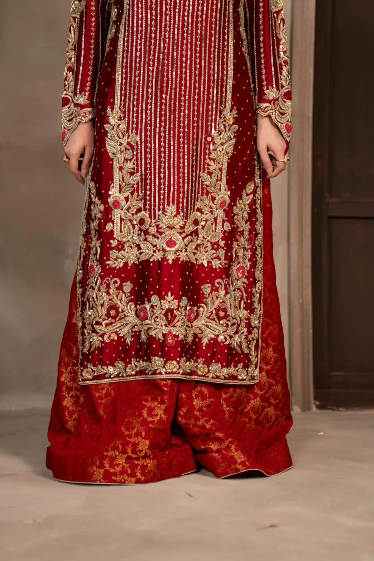 Surkhroo deep red hand embellished Sheesha silk formal suit with Jamawar palazzo and organza dupatta by MariamRaj