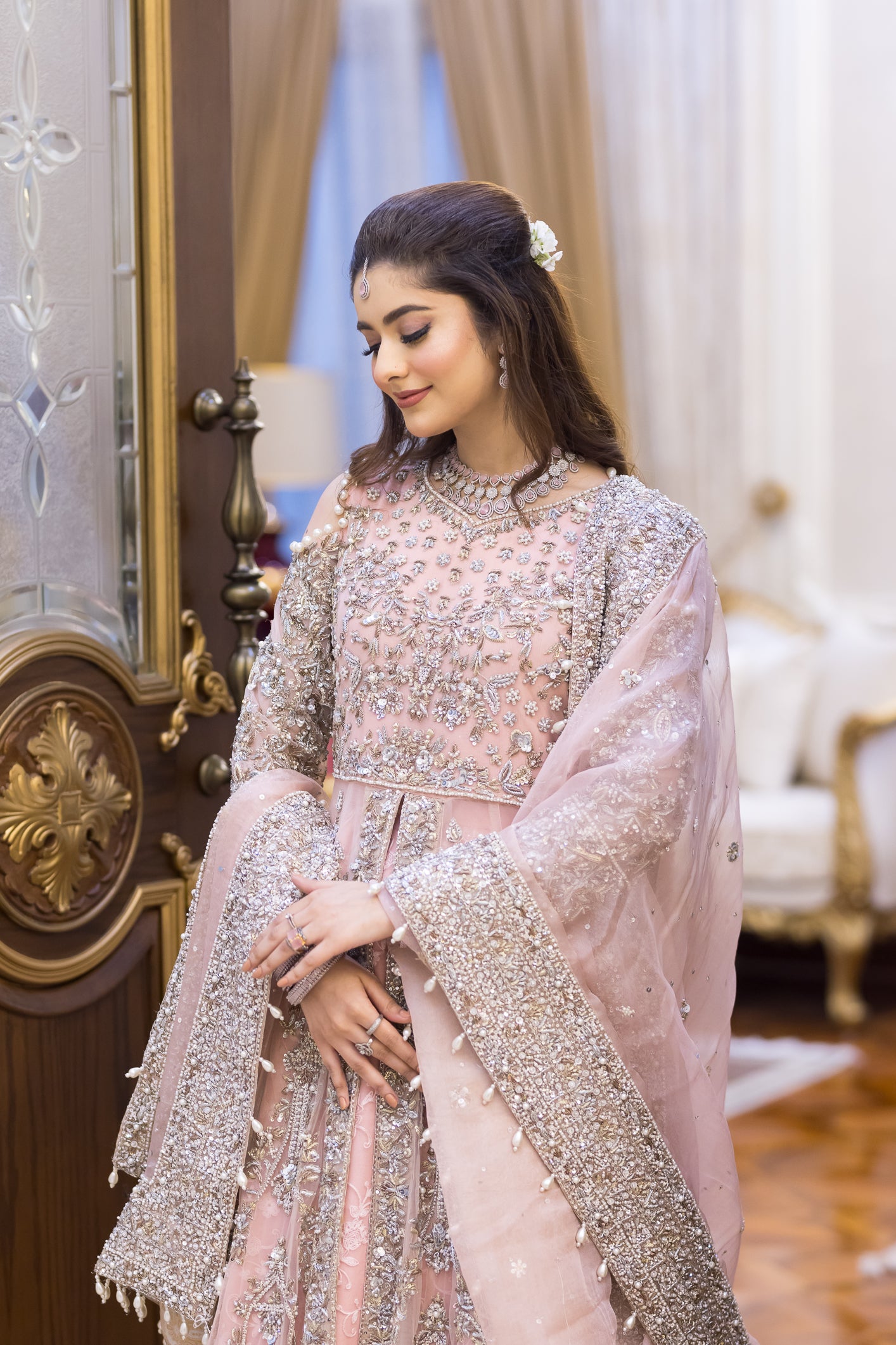 Pakistani formal pink gown with net shirt, organza lehenga, and dupatta – bridal-inspired reception outfit for wedding guests in Canada.
