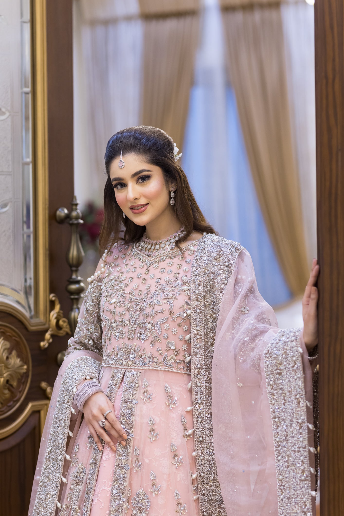 Pakistani formal pink gown with net shirt, organza lehenga, and dupatta – bridal-inspired reception outfit for wedding guests in Canada.
