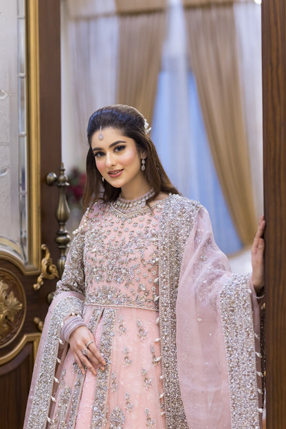 Pakistani formal pink gown with net shirt, organza lehenga, and dupatta – bridal-inspired reception outfit for wedding guests in Canada.