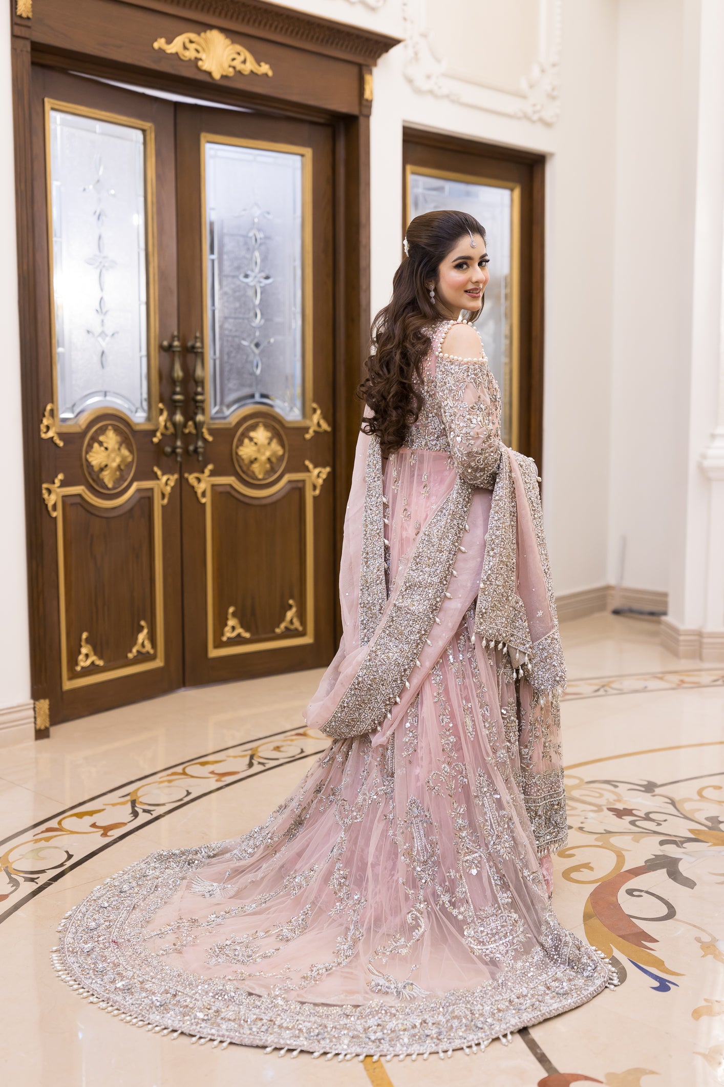 Pakistani formal pink gown with net shirt, organza lehenga, and dupatta – bridal-inspired reception outfit for wedding guests in Canada.
